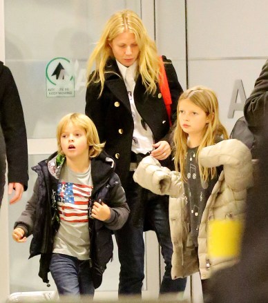 Gwyneth Paltrow lands at JFK Airport with her children Apple and Moses in NYC.  Photographed: Gwyneth Paltrow, Apple Martin, Moses Martin, Gwyneth Paltrow Apple Martin Moses Martin Ref: SPL670531 181213 NON-EXCLUSIVE Photo by: SplashNews.com Splash News and Pictures USA : +1 310-525-5808 London: +44 (0) 20 8126 1009 Berlin: +49 175 3764 166 photodesk@splashnews.com World Rights