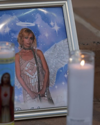 Candles are placed next to a photograph of cinematographer Halyna Hutchins during a vigil in her honor in Albuquerque, N.M. . Hutchins was fatally shot on Thursday, Oct. 21, after an assistant director unwittingly handed actor Alec Baldwin a loaded weapon and told him it was safe to use on the set of a Western filmed in Santa Fe, N.M
Prop Firearm Movie Set, Albuquerque, United States - 23 Oct 2021