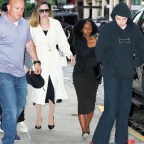 Angelina Jolie Wears A White Trench Coat And Valentino Bag On Her Way To Bond St Sushi Restaurant With Three Of Her Children In New York City