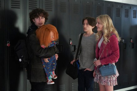 CHUCKY -- "Death by Misadventure" Episode 101 -- Pictured: (l-r) Zackary Arthur as Jake Wheeler, Chucky, Teo Briones as Junior Wheeler, Alyvia Alyn Lind as Lexy Cross -- (Photo by: Steve Wilkie/USA Network)