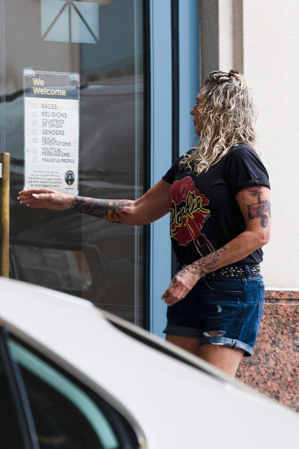 *EXCLUSIVE* Duane 'Dog The Bounty Hunter' Chapman and new wife Francie enjoy a smoke break post wedding