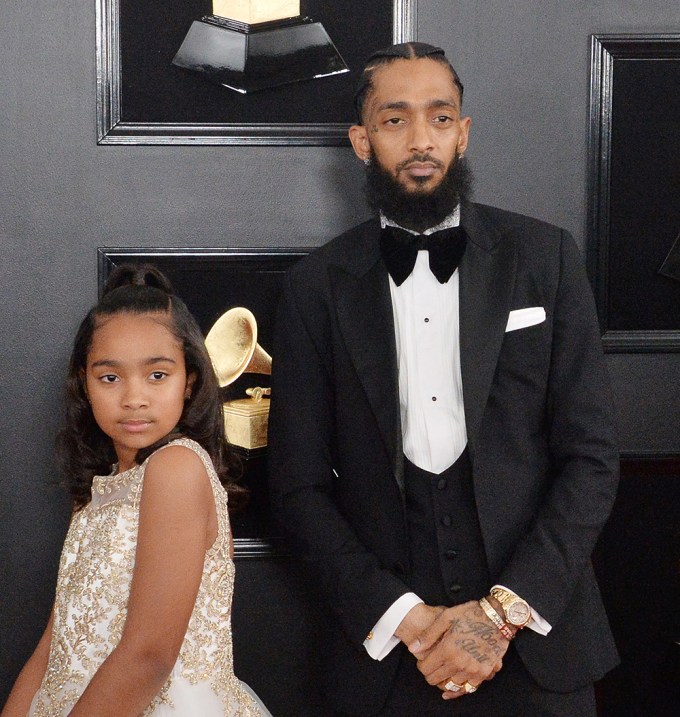 Rapper Nipsey Hussle & Daughter Emani Asghedom Arrive At The 61st Annual Grammy Awards