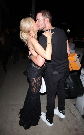 West Hollywood, CA - Pregnant Heather Rae Young celebrates her 35th birthday with Hubby Tarek El Moussa at Craig's in West Hollywood.  The 'Selling Sunset' star elegantly dressed up her growing baby bump in a black lace dress.  While leaving Tarek wasn't shy to show some affection as he passionately kisses Heather.  Pictured: Heather Rae Young, Tarek El Mousa BACKGRID USA 15 SEPTEMBER 2022 BYLINE MUST READ: HEDO / BACKGRID USA: +1 310 798 9111 / usasales@backgrid.com UK: +44 208 344 2007 / uksales@backgrid.com *UK Clients - Pictures Containing Children Please Pixelate Face Prior To Publication*