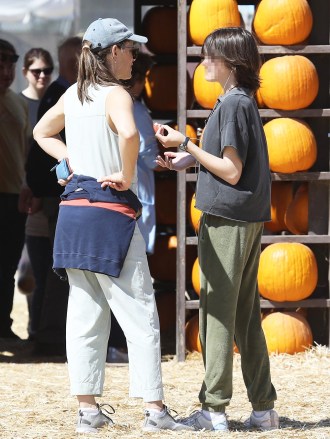 Moorpark, CA  - *EXCLUSIVE*  - Actress Jennifer Garner and her kids Samuel and Seraphina spend the day at a pumpkin patch to celebrate the spooky season. Both Samuel and Seraphine climb to the top of a haystack and Jennifer brings her phone out to capture the moment before she gets to the top herself. The three chose their favorite pumpkins and wheeled them back to their ride to end the day.Pictured: Jennifer Garner, Seraphina AffleckBACKGRID USA 5 OCTOBER 2022 USA: +1 310 798 9111 / usasales@backgrid.comUK: +44 208 344 2007 / uksales@backgrid.com*UK Clients - Pictures Containing ChildrenPlease Pixelate Face Prior To Publication*
