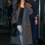 Kim Kardashian Wears Thigh-High Boots Leaving Her Hotel In NYC