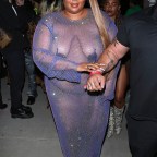 Lizzo leaves little to the imagination in a 'barely there' outfit while leaving Cardi B's Birthday party