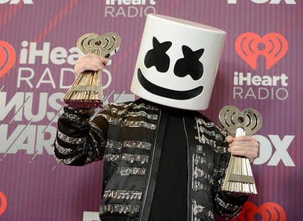 Marshmello poses in the press room with the awards for best new pop artist and dance artist of the year at the iHeartRadio Music Awards, at the Microsoft Theater in Los Angeles
2019 iHeartRadio Music Awards - Press Room, Los Angeles, USA - 14 Mar 2019