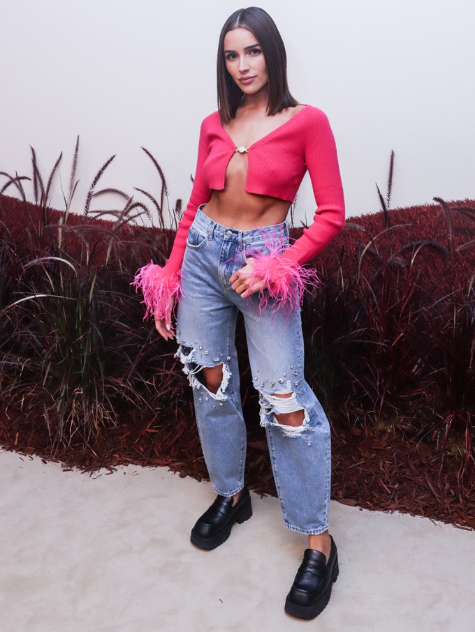 Addison Rae looks cute in pink cargo pants with a black crop top