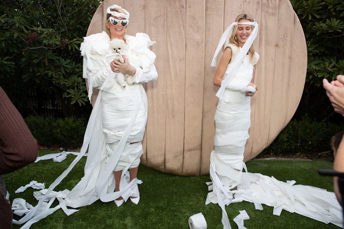 Paris Hilton & Sister-In-Law Tessa Hilton Joke Around In Toilet Paper Wedding Dresses