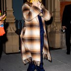 Amy Schumer Rocks A Patterned Coat As She Arrives With Aidy Bryant To The SNL After Party At Zero Bond