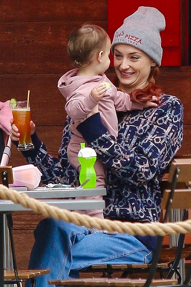 Sophie Turner gazes lovingly at her three-month-old baby girl Willa on a  morning walk