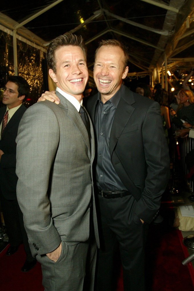 Mark and Donnie Wahlberg pose together at a premiere