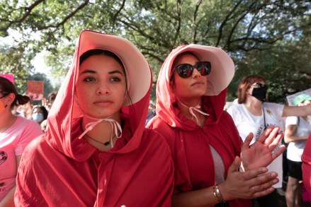 October 2, 2021, Austin, TX, United States: Several thousand Texas women rally at the Capitol south steps to protest recent Texas laws passed restricting women's right to abortion. A restrictive Texas abortion law makes it a crime to have an abortion after six weeks in most cases. 02 Oct 2021 Pictured: October 2, 2021, Austin, TX, United States: Protesters RITA MEYERS and MAYA RASER of Austin listen as several thousand Texas women rally at the Capitol south steps to protest recent Texas laws passed restricting women's right to abortion. A restrictive Texas abortion law makes it a crime to have an abortion after six weeks in most cases. Photo credit: ZUMAPRESS.com / MEGA TheMegaAgency.com +1 888 505 6342 (Mega Agency TagID: MEGA792812_026.jpg) [Photo via Mega Agency]