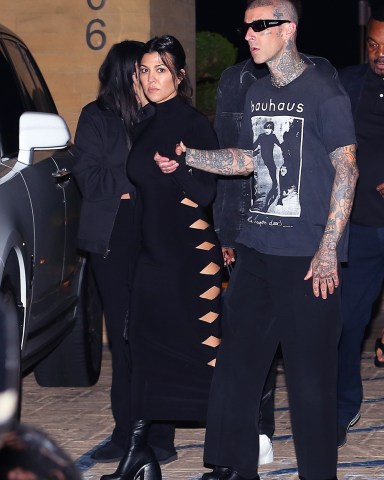 Malibu, CA  - *EXCLUSIVE*  - The Barkers are celebrating their recent wedding with a date night at Nobu and we catch Kourtney Kardashian Barker in a killer black dress meanwhile Travis wears his signature dark style. Travis Barker's stepdaughter Atiana De La Hoya was also seen leaving the restaurant with the couple.

Pictured: Kourtney Kardashian, Travis Barker

BACKGRID USA 2 JUNE 2022 

USA: +1 310 798 9111 / usasales@backgrid.com

UK: +44 208 344 2007 / uksales@backgrid.com

*UK Clients - Pictures Containing Children
Please Pixelate Face Prior To Publication*
