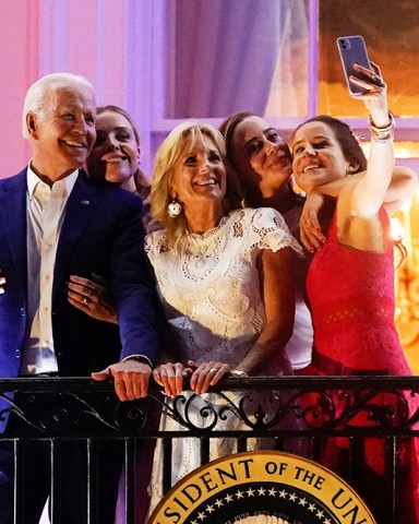 President Joe Biden poses for a photo with granddaughter Finnegan Biden, from left, first lady Jill Biden, granddaughter Naomi Biden and daughter Ashley Biden as they view fireworks during an Independence Day celebration on the South Lawn of the White House, in Washington
Biden July 4, Washington, United States - 04 Jul 2021