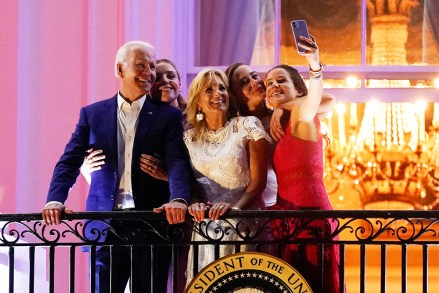 President Joe Biden poses for a photo with his grandson Finnegan Biden, from left, first lady Jill Biden, granddaughter Naomi Biden and daughter Ashley Biden as they watch fireworks during the Independence Day celebration on the South Lawn of the White House, in Washington Biden July 4 , Washington, United States - 04 Jul 2021