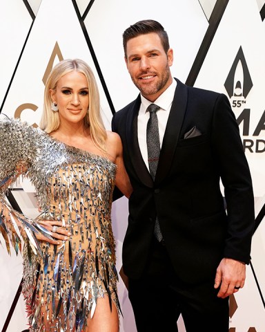Carrie Underwood, left, and Mike Fisher arrive at the 55th annual CMA Awards, at the Bridgestone Arena in Nashville, Tenn
55th Annual Country Music Awards - Arrivals, Nashville, United States - 10 Nov 2021