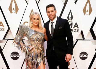 Carrie Underwood, left, and Mike Fisher arrive at the 55th annual CMA Awards, at the Bridgestone Arena in Nashville, Tenn
55th Annual Country Music Awards - Arrivals, Nashville, United States - 10 Nov 2021