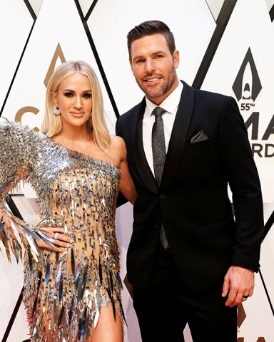 Carrie Underwood, left, and Mike Fisher arrive at the 55th annual CMA Awards, at the Bridgestone Arena in Nashville, Tenn
55th Annual Country Music Awards - Arrivals, Nashville, United States - 10 Nov 2021