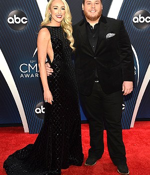 Nicole Hocking, Luke Combs. Nicole Hocking, left, and Luke Combs arrive at the 52nd annual CMA Awards at Bridgestone Arena, in Nashville, Tenn52nd Annual CMA Awards - Arrivals, Nashville, USA - 14 Nov 2018