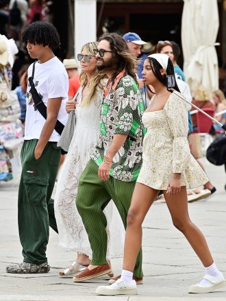 VENICE, ITALY  - *EXCLUSIVE*  - Heidi Klum and her husband, Tom Kaulitz, exude style in Venice. Tom impresses in a fashionable green ensemble, while Heidi shines in a flowing white summer dress.PICS TAKEN: 23/06/2023Pictured: Heidi Klum , Tom KaulitzBACKGRID USA 25 JUNE 2023 BYLINE MUST READ: Cobra Team / BACKGRIDUSA: +1 310 798 9111 / usasales@backgrid.comUK: +44 208 344 2007 / uksales@backgrid.com*UK Clients - Pictures Containing ChildrenPlease Pixelate Face Prior To Publication*