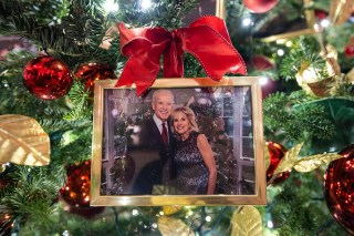 A photo of US President Joe Biden and First Lady Jill Biden hangs from a Christmas tree in the State Dining Room during a press preview of the 2021 holiday decor at the White House in Washington, DC, USA, 29 November 2021. According to First Lady Jill Biden's office, the theme for the 2021 White House holiday season is 'Gifts from the Heart.' Approximately 6,000 feet of ribbon, over 300 candles, and over 10,000 ornaments were used this year to decorate the White House. There are also 41 Christmas trees throughout the White House.
Holiday Decor at the White House, Washington, Usa - 29 Nov 2021