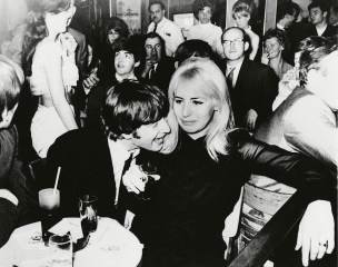 John Lennon, one of the Beatles, and his wife, Cynthia, are shown in a night spot after the visiting British Rock 'N' Rollers made their New York debut . Paul McCartney is behind LennonCynthia Lennon and John Lennon, New York, USA