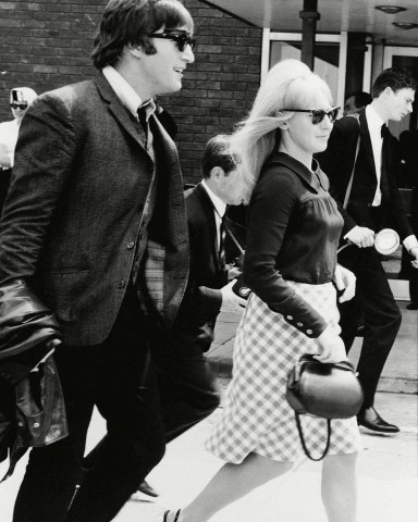 Beatle John Lennon and his wife, Cynthia, pictured at London Airport, when the group arrived from their three-week tour of Australia and New Zealand. At a press conference after his arrival, Lennon denied a rumor that he was leaving the groupCynthia Lennon and John Lennon, London, United Kingdom England