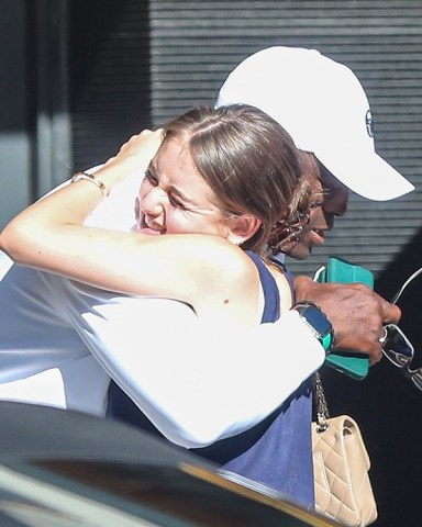 Beverly Hills, CA  - *EXCLUSIVE*  - Seal and daughter Leni Klum share a warm embrace after having Tuesday dinner at the Honor Bar restaurant in Beverly Hills.  Pictured: Seal, Leni Klum   BACKGRID USA 19 JULY 2022   BYLINE MUST READ: SPOT / BACKGRID  USA: +1 310 798 9111 / usasales@backgrid.com  UK: +44 208 344 2007 / uksales@backgrid.com  *UK Clients - Pictures Containing Children Please Pixelate Face Prior To Publication*