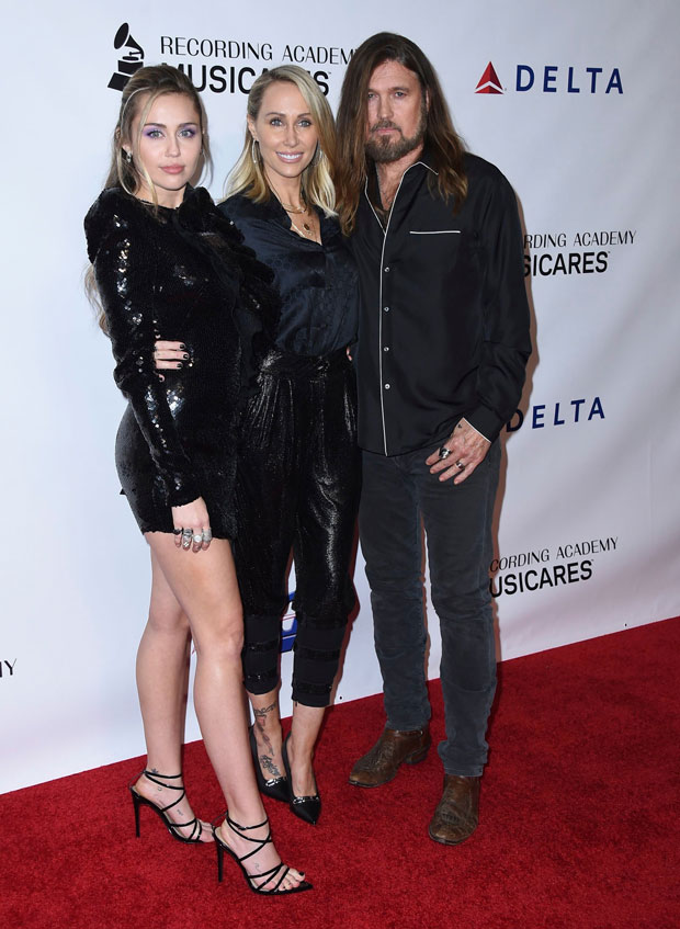 Miley Cyrus with parents Billy Ray and Trish Cyrus 