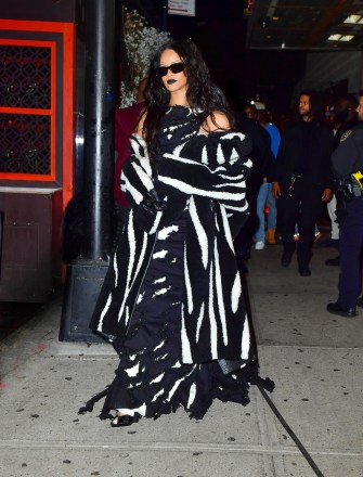 New York, NY  - *EXCLUSIVE*  - Singer Rihanna channels her inner Beetle Juice as she steps out for her brother Rory's Halloween party in NYC at 5am. The singer stepped out in a black and white dress and matching coat for the event.Pictured: RihannaBACKGRID USA 1 NOVEMBER 2021 BYLINE MUST READ: PapCulture / BACKGRIDUSA: +1 310 798 9111 / usasales@backgrid.comUK: +44 208 344 2007 / uksales@backgrid.com*UK Clients - Pictures Containing ChildrenPlease Pixelate Face Prior To Publication*