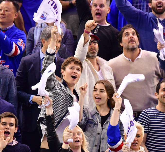 Ansel Elgort and Violetta Komyshan attend a NHL game