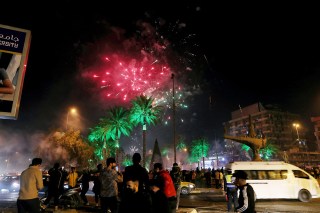 People watch fireworks explode during New Year celebrations in Baghdad, Iraq, early
New Year , Baghdad, Iraq - 31 Dec 2021