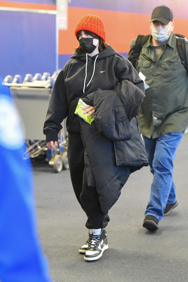 BTS arrive at JFK Airport in NY wearing face masks ahead of New