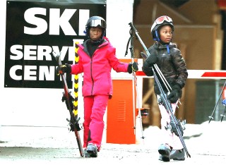 Gstaad, SWITZERLAND  - *EXCLUSIVE*  - Madonna's twin daughters Estere and Stella (adopted), aged 9, with their Ski Instructor and Nanny on a ski lift, having a snack at the top of the Eggli slopes in the famous ski resort of Gstaad, Switzerland.Pictured: Estere, StellaBACKGRID USA 2 JANUARY 2022USA: +1 310 798 9111 / usasales@backgrid.comUK: +44 208 344 2007 / uksales@backgrid.com*UK Clients - Pictures Containing Children
Please Pixelate Face Prior To Publication*