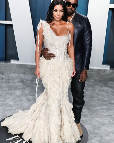 Television personality Kim Kardashian West wearing an Alexander McQueen dress and Lorraine Schwartz jewelry and husband/rapper Kanye West wearing a Dunhill look arrive at the 2020 Vanity Fair Oscar Party held at the Wallis Annenberg Center for the Performing Arts on February 9, 2020 in Beverly Hills, Los Angeles, California, United States.
2020 Vanity Fair Oscar Party, Beverly Hills, United States - 10 Feb 2020