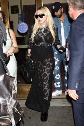 New York, NY - *EXCLUSIVE* - A fashionable Madonna stuns in a black lace gown while leaving MJ The Musical on Broadway in New York.  Pictured: Madonna BACKGRID USA JULY 30, 2022 USA: +1 310 798 9111 / usasales@backgrid.com UK: +44 208 344 2007 / uksales@backgrid.com *UK Customers - Pictures Containing Children Please pixelate face before post*