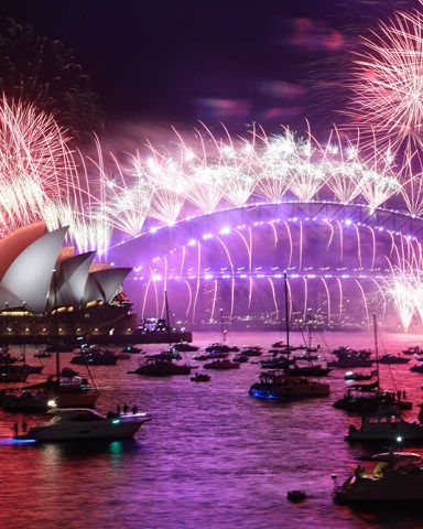 New Year's Eve midnight fireworks looking at the Sydney Opera House and Sydney Harbour Bridge viewed from Mrs Macquaires Point, Royal Botanic Garden Sydney.
New Year's Eve celebrations, Sydney, Australia - 01 Jan 2022