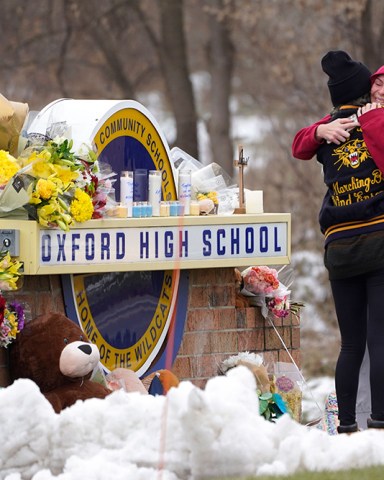 Students hug at a memorial at Oxford High School in Oxford, Mich., . Authorities say a 15-year-old sophomore opened fire at Oxford High School, killing four students and wounding seven other people on Tuesday
School Shooting Michigan, Oxford, United States - 01 Dec 2021