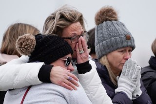Mourners grieve at a memorial at Oxford High School in Oxford, Mich., . Authorities say a 15-year-old sophomore opened fire at Oxford High School, killing four students and wounding seven other people on Tuesday
School Shooting Michigan, Oxford, United States - 01 Dec 2021