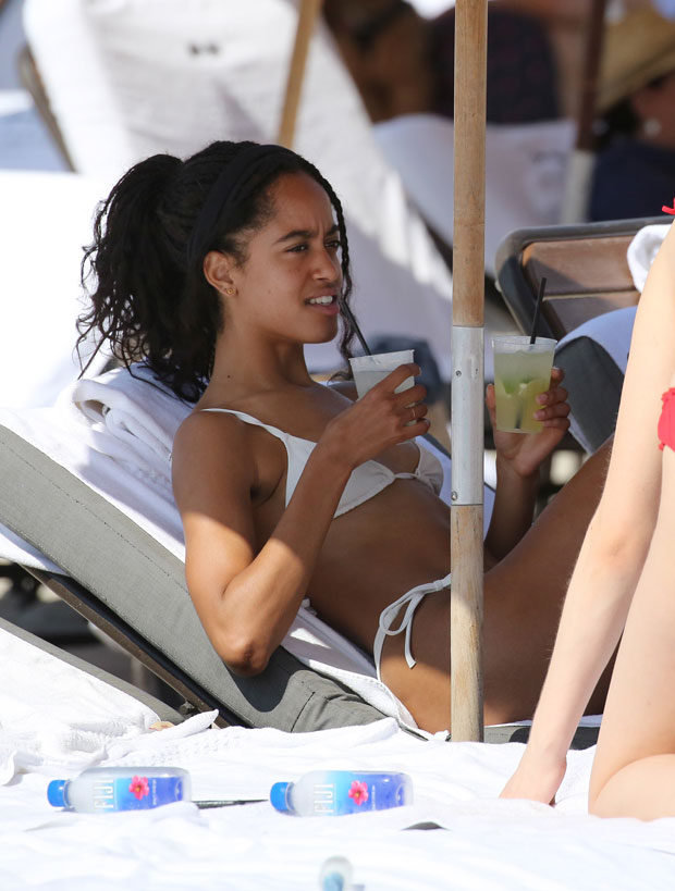 Malia Obama wore a white bikini as she relaxed with friends on the beach in...