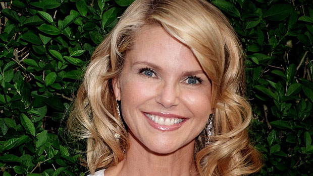 Christie Brinkley Rocks Plunging One-Piece Swimsuit & Wrap Skirt On Family Vacation.jpg