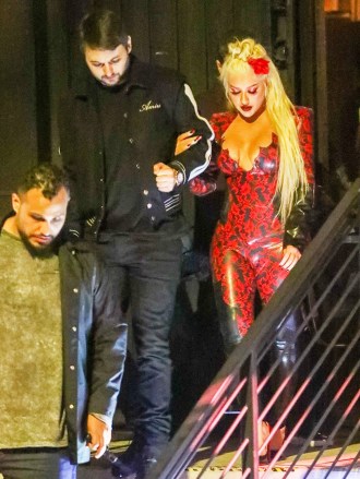 Los Angeles, CA - *EXCLUSIVE* - Christina Aguilera appears to be in a partying mood as she steps out with beau Matthew Rutler for a night out in Los Angeles.  The songstress turned heads as she put her curves on display in a bodycon leather jumpsuit with red design detail.  Pictured: Christina Aguilera, Matthew Rutler BACKGRID USA 7 FEBRUARY 2022 BYLINE MUST READ: The Daily Stardust / BACKGRID USA: +1 310 798 9111 / usasales@backgrid.com UK: +44 208 344 2007 / uksales@backgrid.com *UK Clients - Pictures Containing Children Please Pixelate Face Prior To Publication*