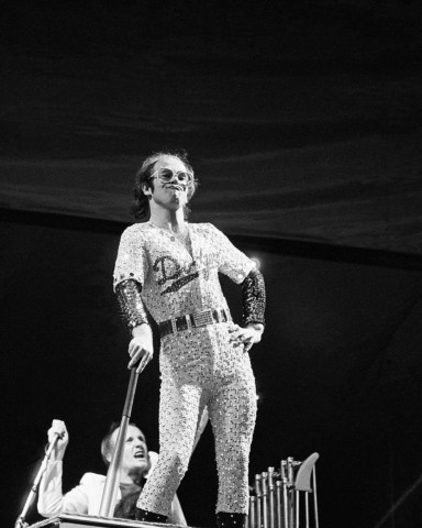 Editorial Use Only / Consent for book publication must be agreed with Rex Features before useMandatory Credit: Photo by Andre Csillag/Shutterstock (10196907ax)Sir Elton JohnElton John in concert at Dodger Stadium, Los Angeles, USA - October 1975