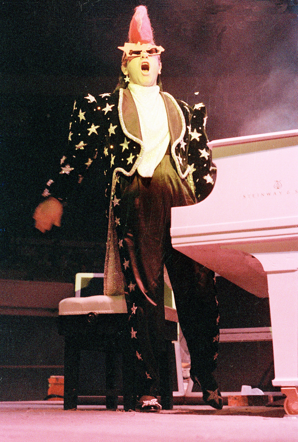 7 of Elton John's most iconic outfits