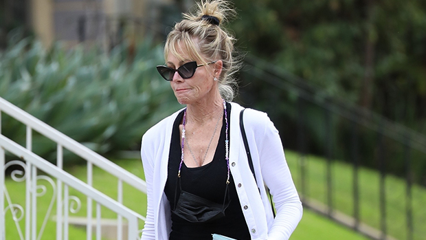 Melanie Griffith, 64, Smokes A Cigarette & Rocks Tight Black Activewear On Outing.jpg