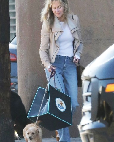 West Hollywood, CA  - *EXCLUSIVE* Melanie Griffith was spotted picking up lunch to go with her dog from Petrossian Restaurant & Boutique in West Hollywood.Pictured: Melanie GriffithBACKGRID USA 19 DECEMBER 2022 BYLINE MUST READ: PrimePix / BACKGRIDUSA: +1 310 798 9111 / usasales@backgrid.comUK: +44 208 344 2007 / uksales@backgrid.com*UK Clients - Pictures Containing ChildrenPlease Pixelate Face Prior To Publication*