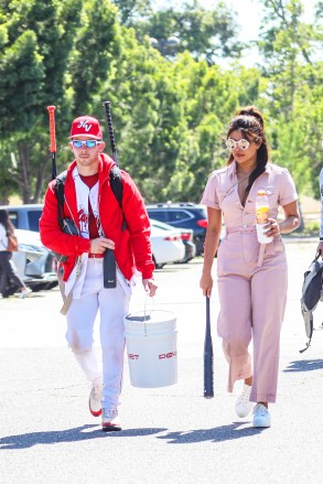 Encino, CA - Nick Jonas and Priyanka Chopra at his baseball game in Encino.  Pictured: Nick Jonas, Priyanka Chopra BACKGRID USA 22 MAY 2022 USA: +1 310 798 9111 / usasales@backgrid.com UK: +44 208 344 2007 / uksales@backgrid.com * UK Clients - Pictures Containing Children Please Pixelate Face Prior To Publication *