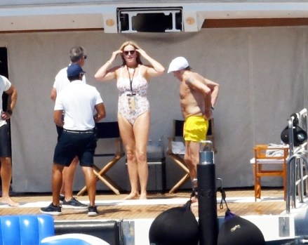 Elba, ITALY - *EXCLUSIVE* - Sir Rod Stewart, 77, and his wife Penny Lancaster, 51, enjoy the Tuscan sunshine while on vacation on the island of Elba.  Rod is enjoying his vacation with his wife of 15 years, Penny and their son.  Rod, ever so gentlemanly, was seen reaching out to help Penny as she climbed the ladder after a dip in the sea. On Monday, the superstar shared a family photo with 7 of his 8 children .  The Downtown Train singer was spotted relaxing while enjoying a day aboard the St. David on the Mediterranean.  The super yacht comes with all the luxury amenities including a fully equipped gym, jacquzzi and tons of ready-to-use toys including wave runners, sea bobs, wakeboards, kayaks and of course a large inflatable raft that Rod seemed to enjoy a lot!  Pictured: Rod Stewart, Penny Lancaster BACKGRID USA 4 AUG 2022 USA: +1 310 798 9111 / usasales@backgrid.com UK: +44 208 344 2007 / uksales@backgrid.com *UK Clients - Images containing children Please pixelate face before Publication*