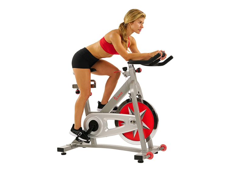 A woman on a stationary exercise bike